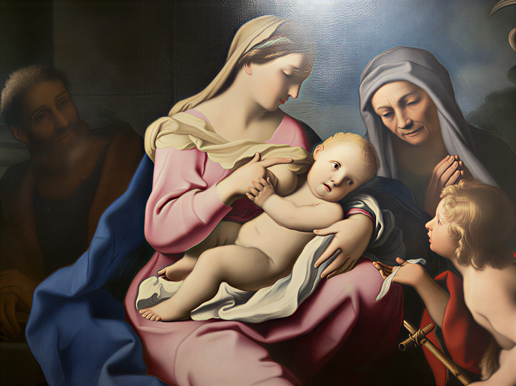 Détail d'une œuvre de la Renaissance italienne, représentant la Vierge Marie et l'Enfant Jésus, entourés de figures religieuses, dans un cadre artistique riche et coloré.