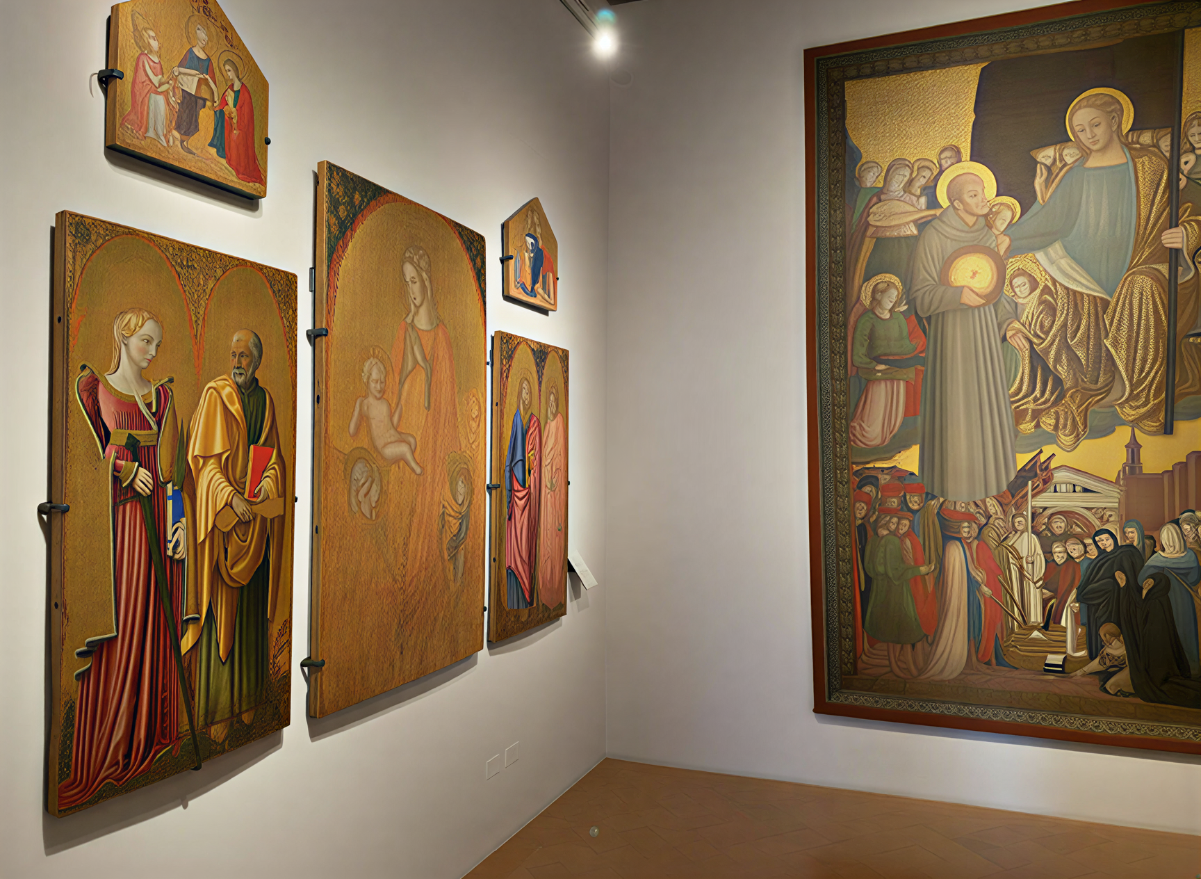 Photographie des chefs-d'œuvre de la Renaissance italienne exposés à la Galleria Nazionale dell'Umbria, mettant en avant des panneaux peints de saints et de scènes religieuses.