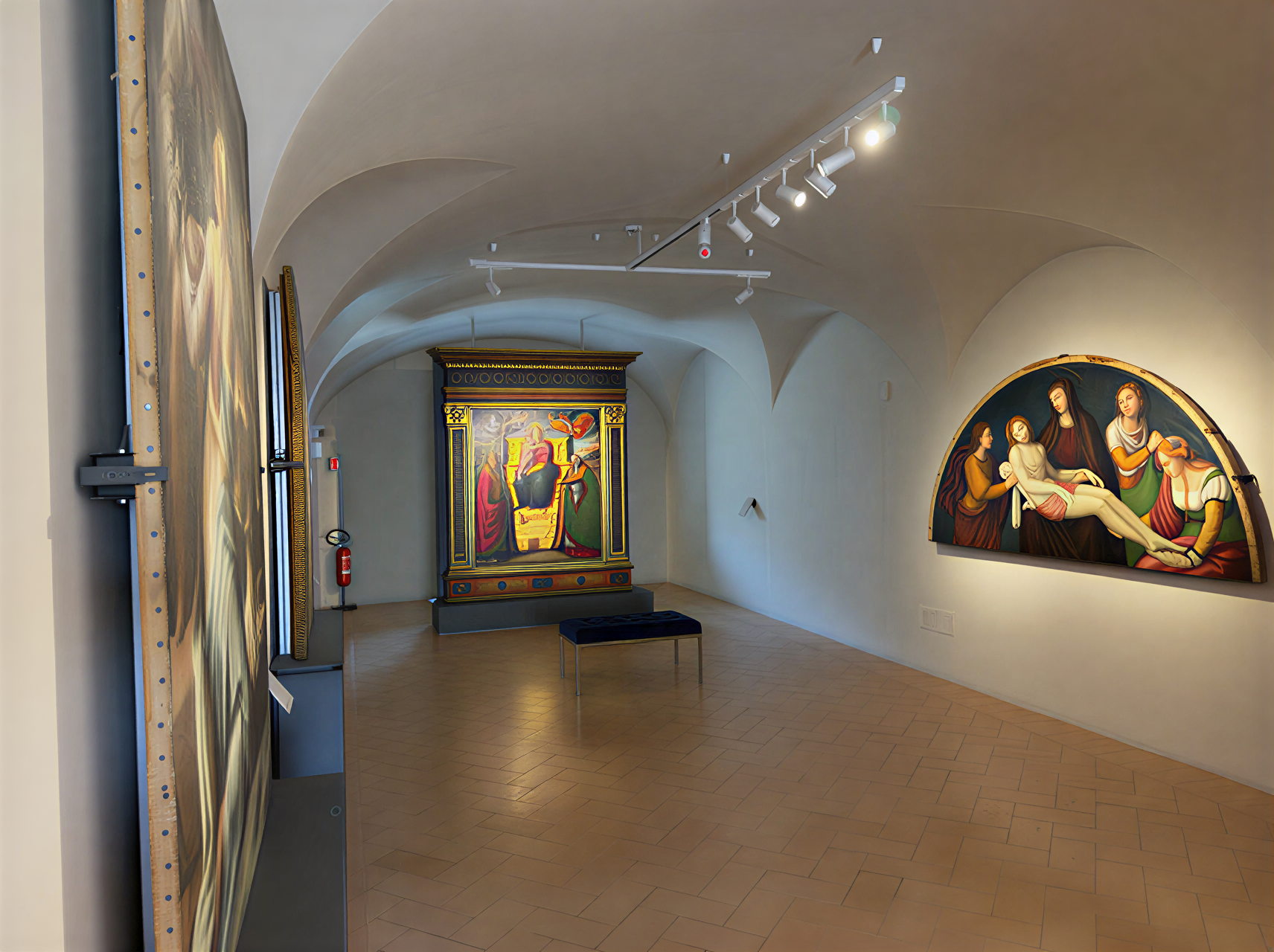 Intérieur de la Galleria Nazionale dell'Umbria, présentant des œuvres de la Renaissance italienne dans un cadre élégant et lumineux.